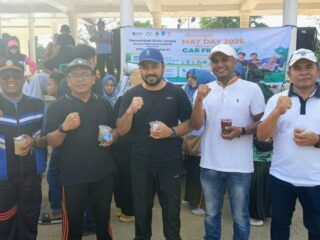 PTPN IV Regional VI Bersama Disnaker Kota Langsa Bagi Bubur Gratis Peringati Hari Buruh di Car Free Day 